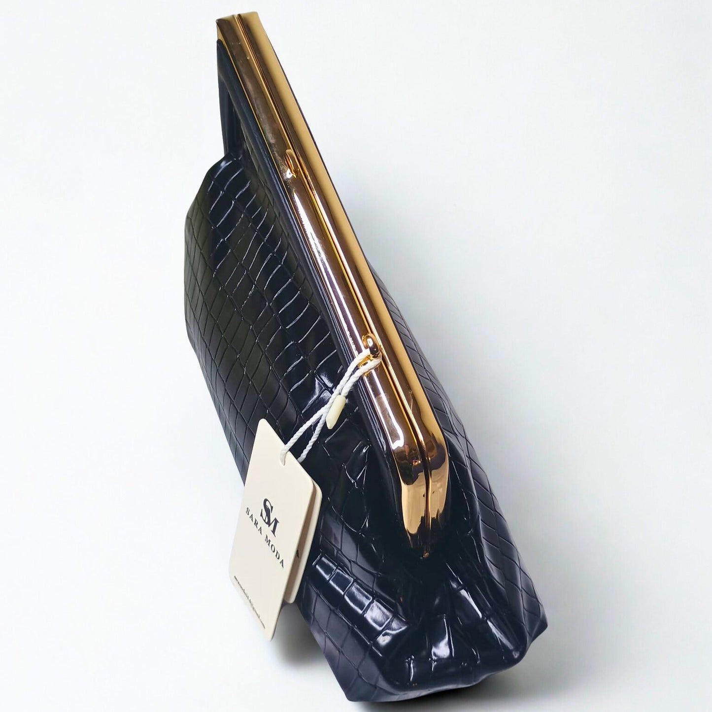 Black crocodile-patterned clutch bag with gold handle on a white background