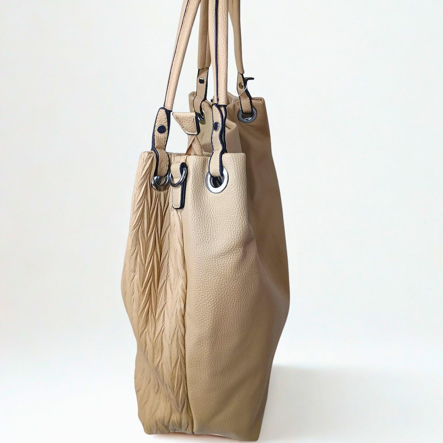 Beige handbag with leather texture on a white background