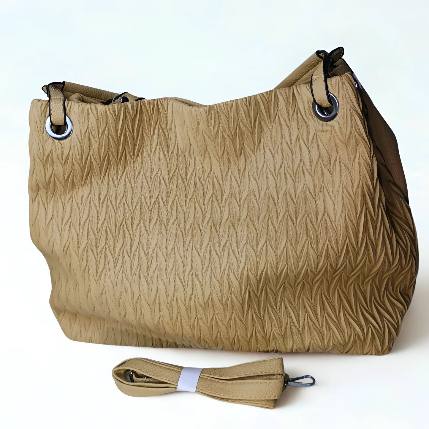 Beige textured handbag with a detachable strap on a white background