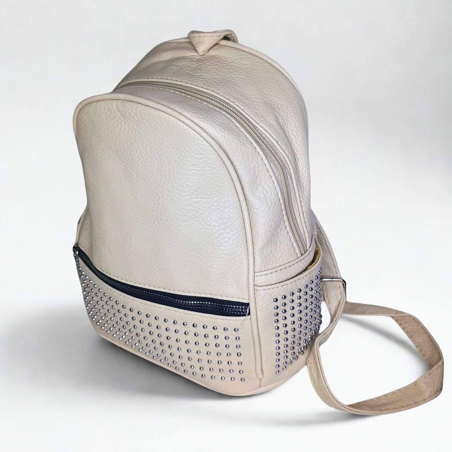 Beige backpack with studded detail on a white background