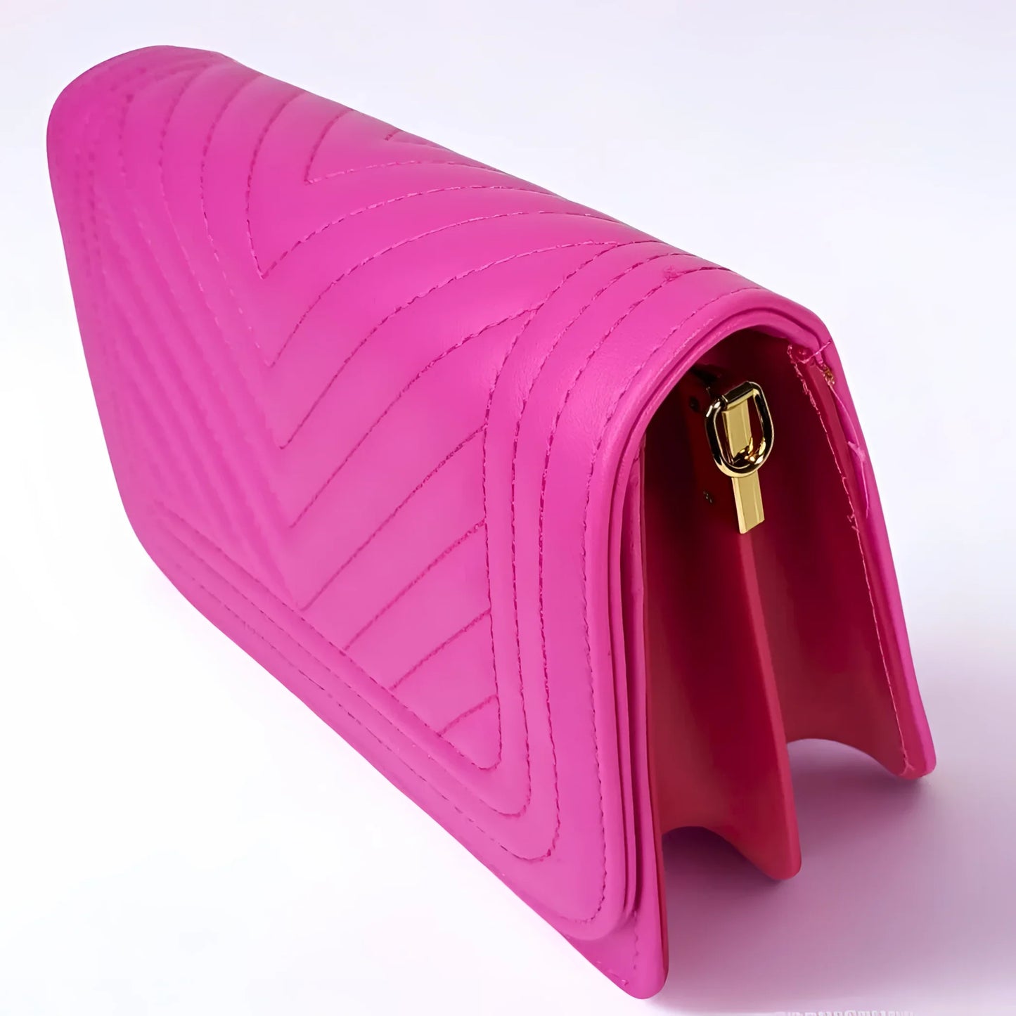Pink quilted handbag with a gold clasp on a white background