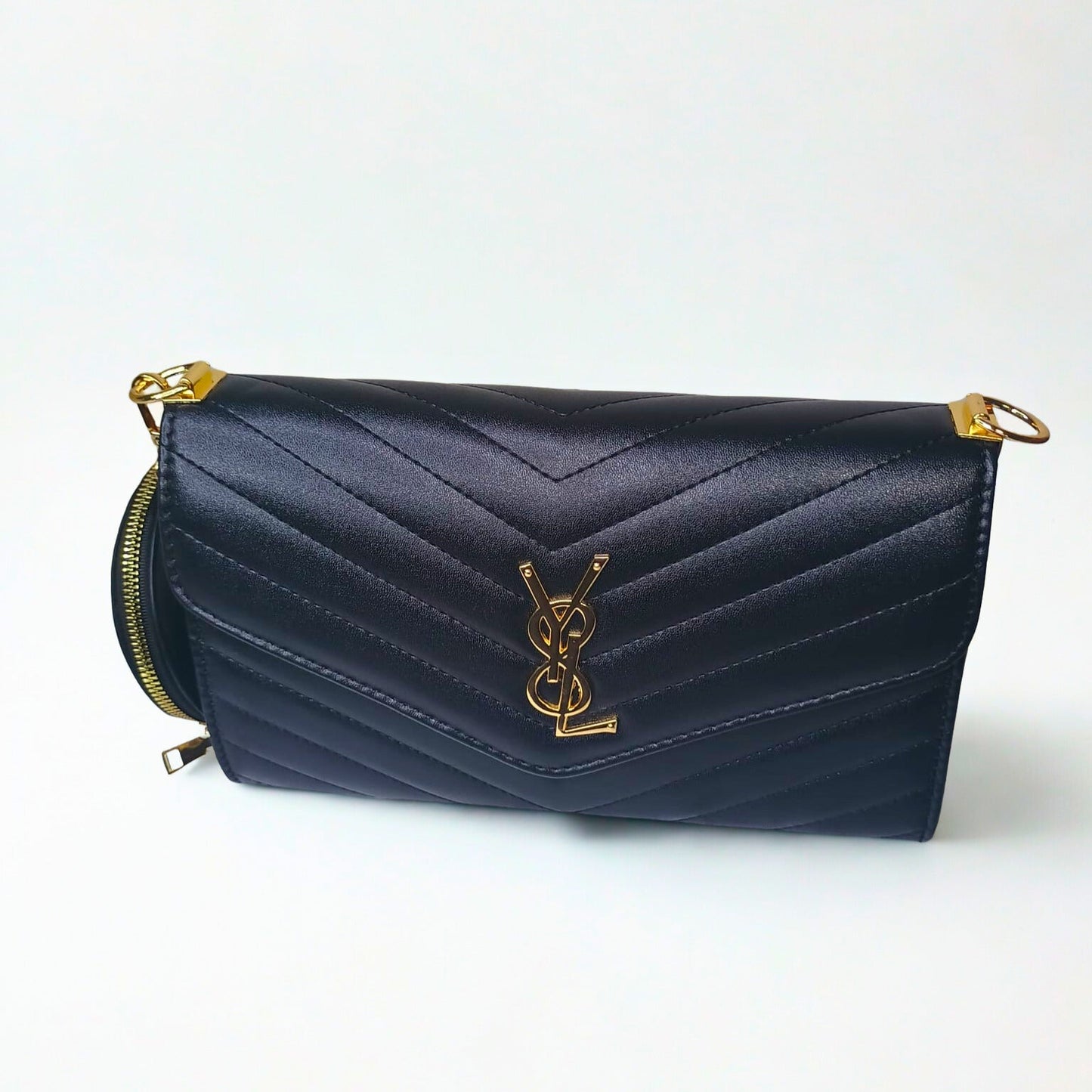 Navy blue handbag with gold accents on a white background