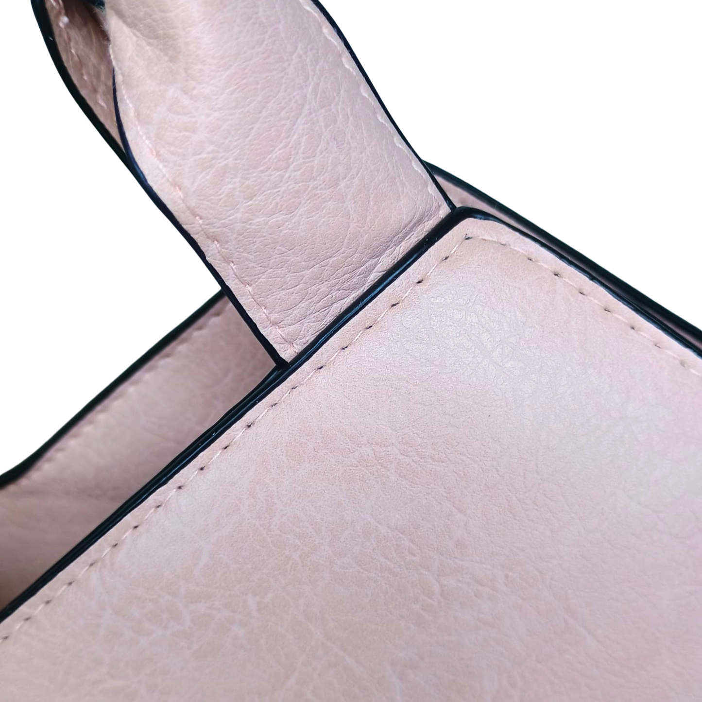 Close-up of a beige leather handbag handle on a white background
