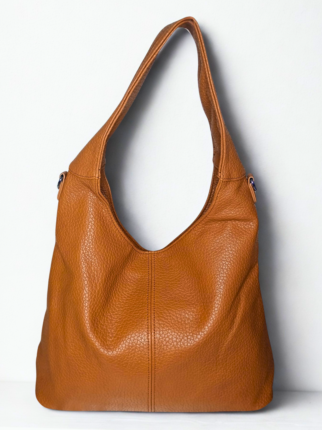 Brown leather handbag on a white background