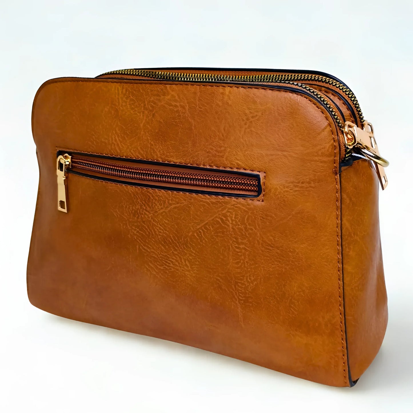 Brown leather clutch bag with gold zipper on a white background
