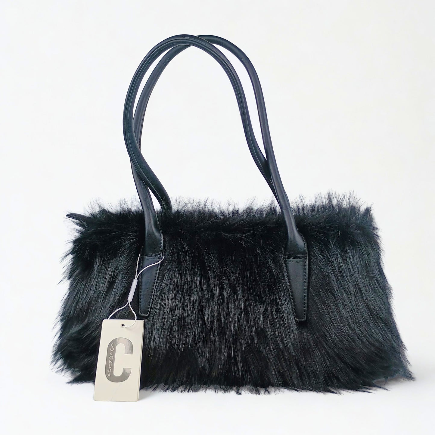 Black fur handbag with a visible brand tag on a white background