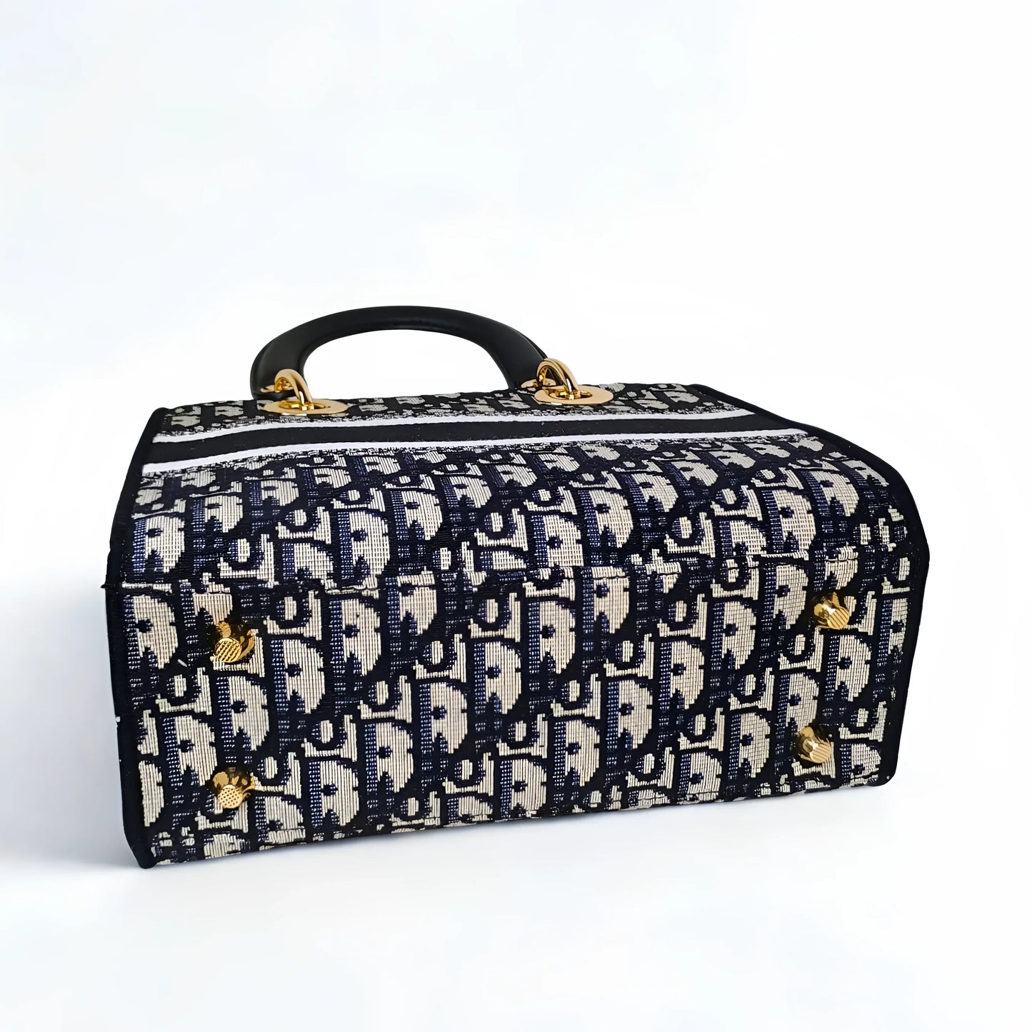 Patterned suitcase with gold accents on a white background