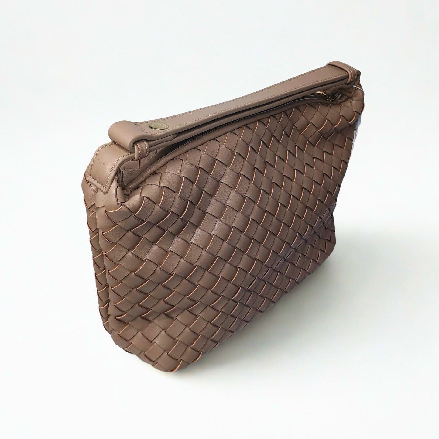 Brown woven handbag on a white background