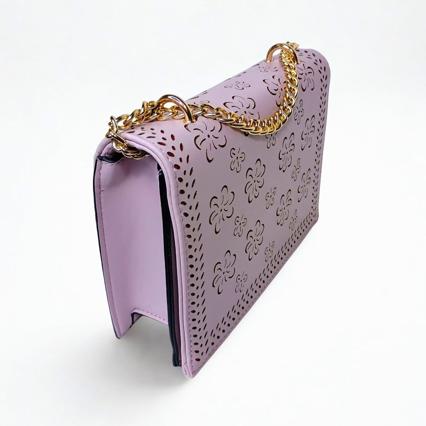 Lavender handbag with floral patterns and a gold chain handle on a white background