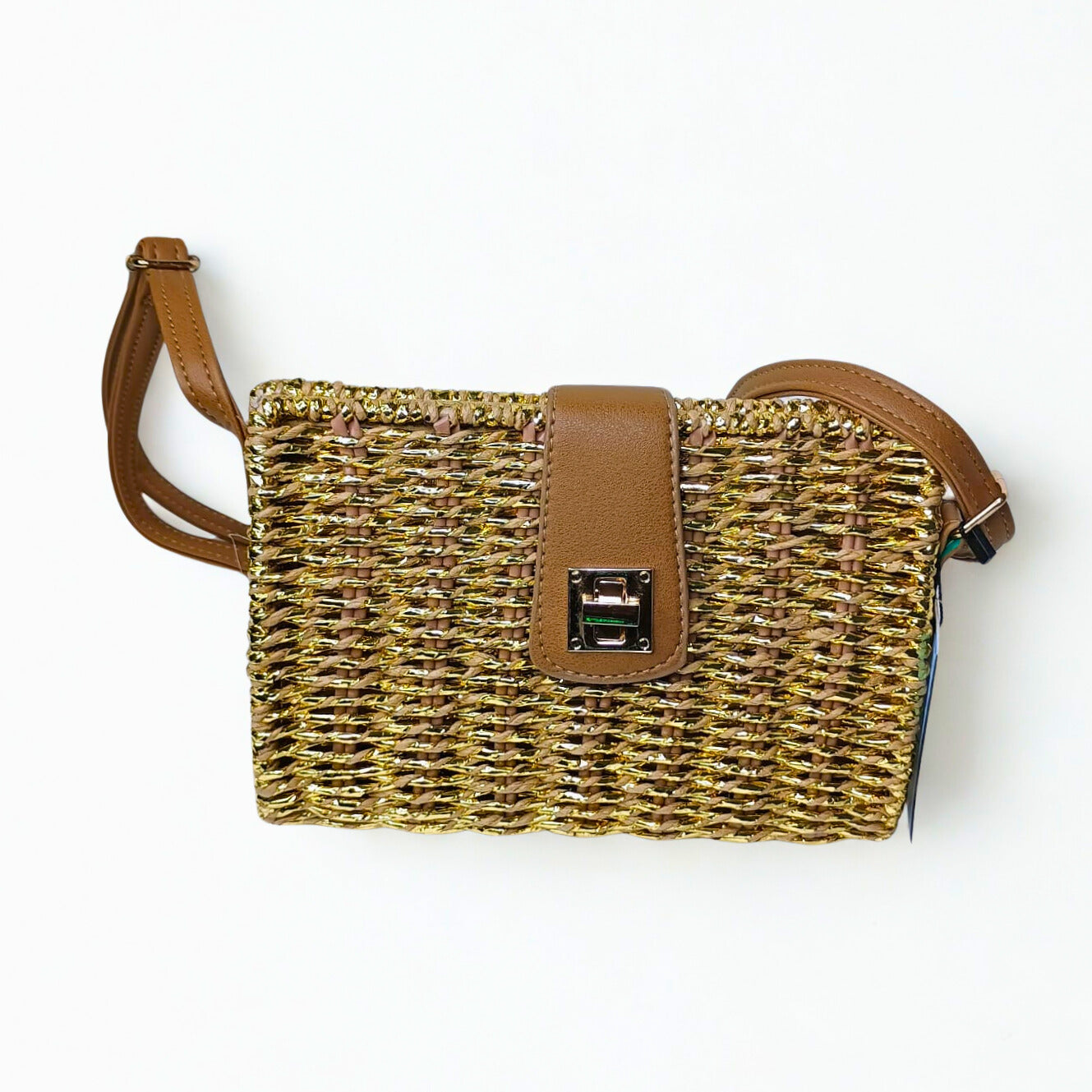 Woven handbag with brown leather strap and clasp on a white background