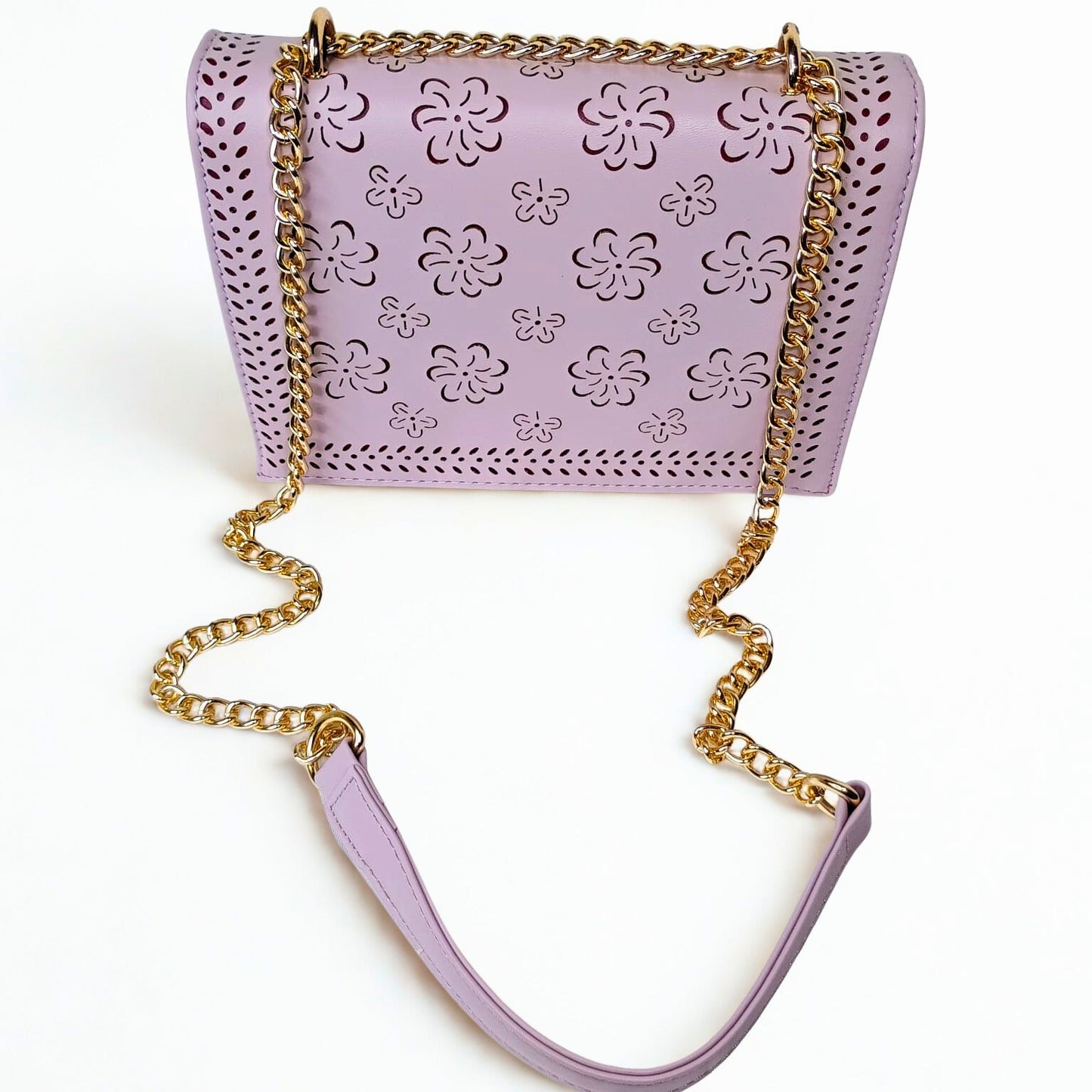 Purple handbag with floral patterns and gold chain strap on a white background