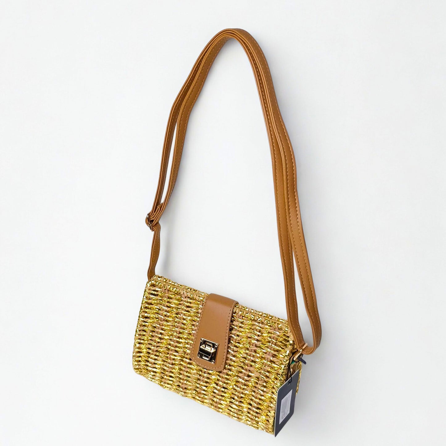 Yellow woven handbag with a brown strap on a white background