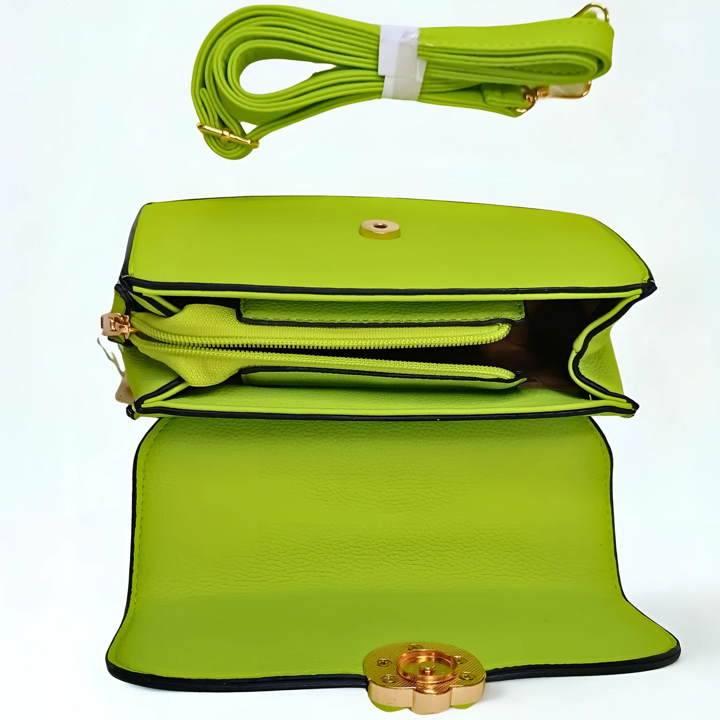 Green handbag with a strap and clasp on a white background