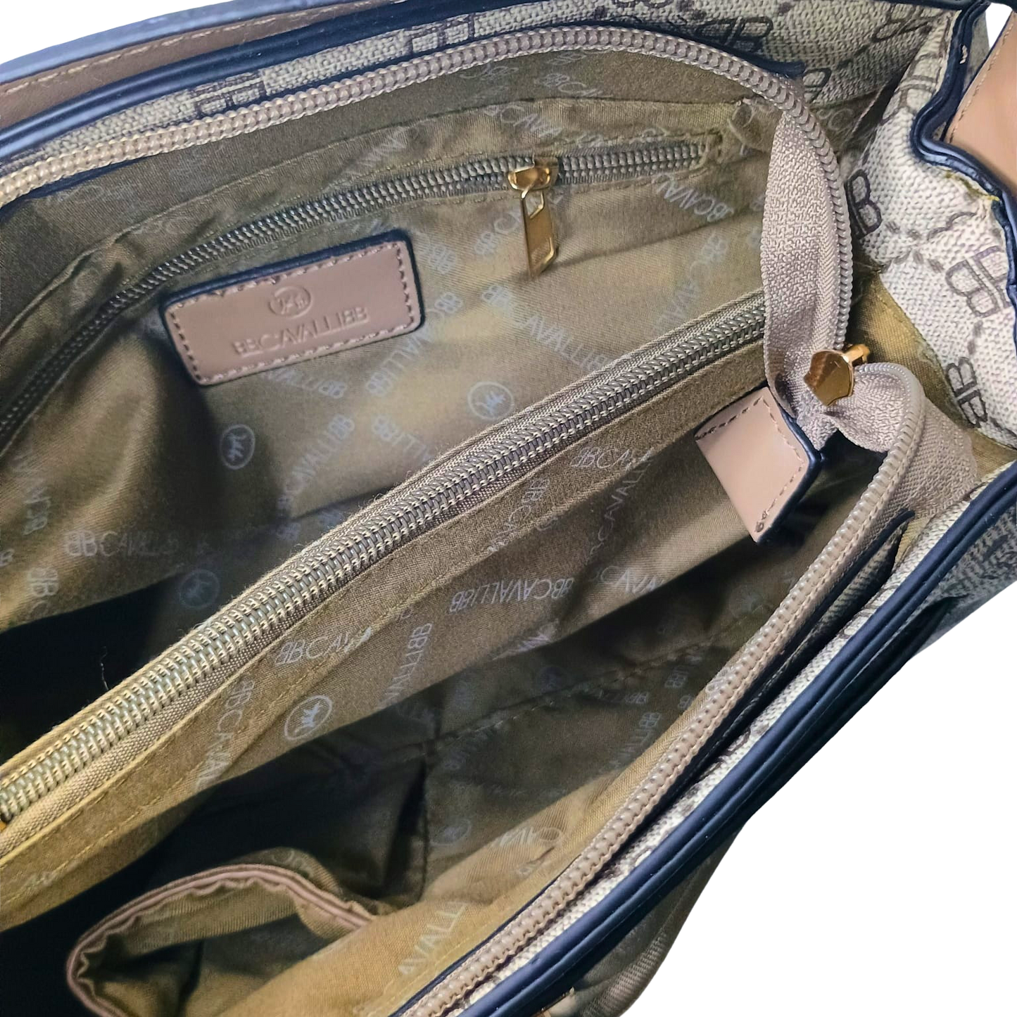 Open handbag revealing a patterned interior with visible brand name.