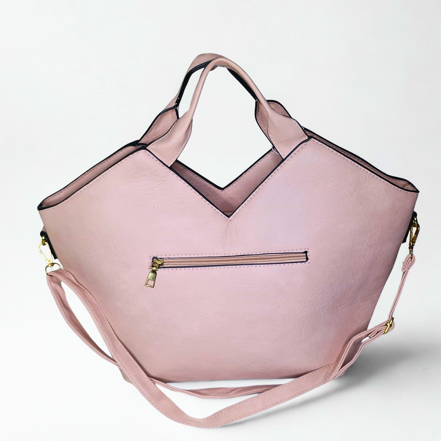 Pink handbag with a strap on a light gray background