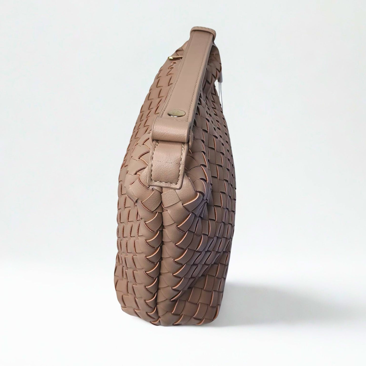 Brown woven handbag on a white background