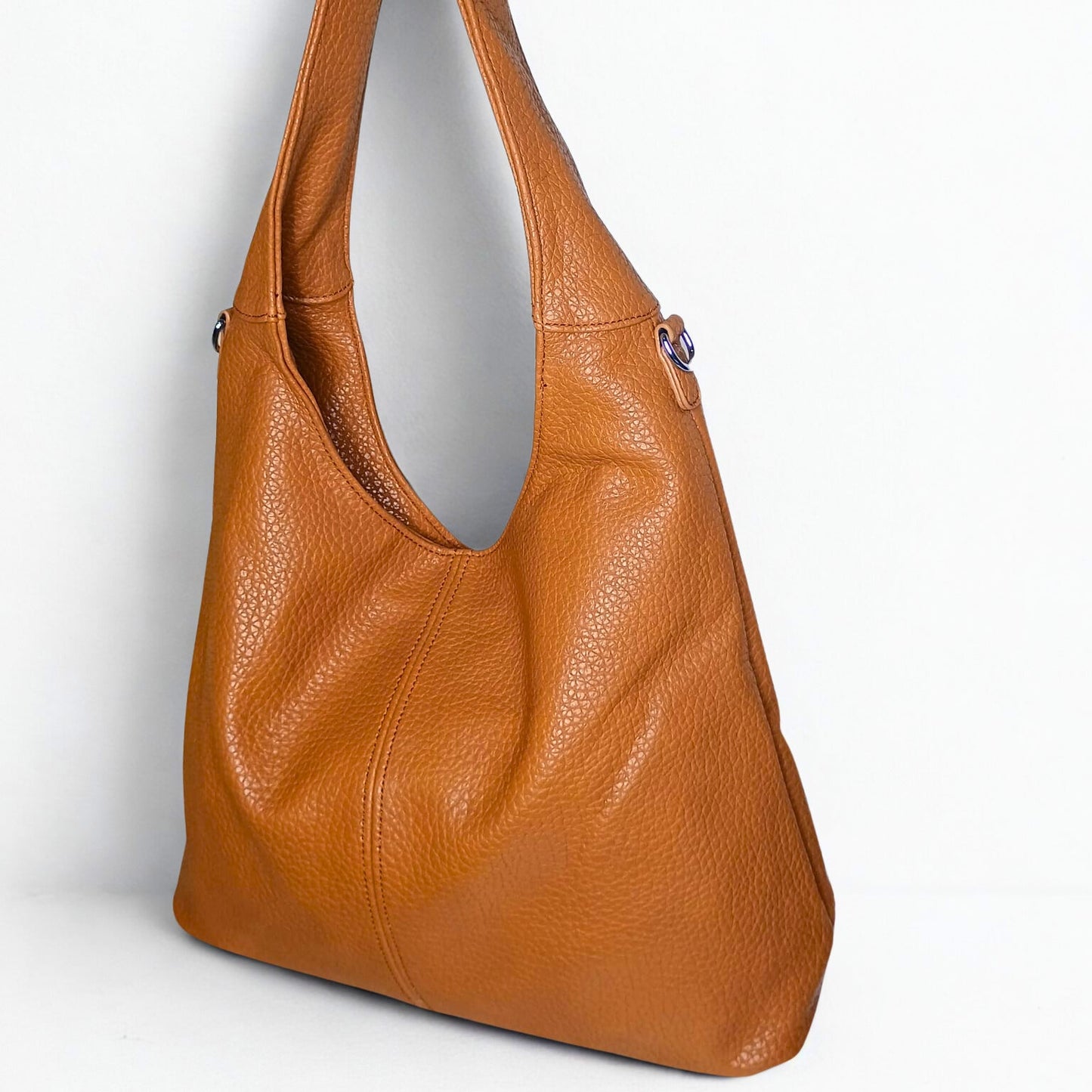 Brown leather handbag on a white background