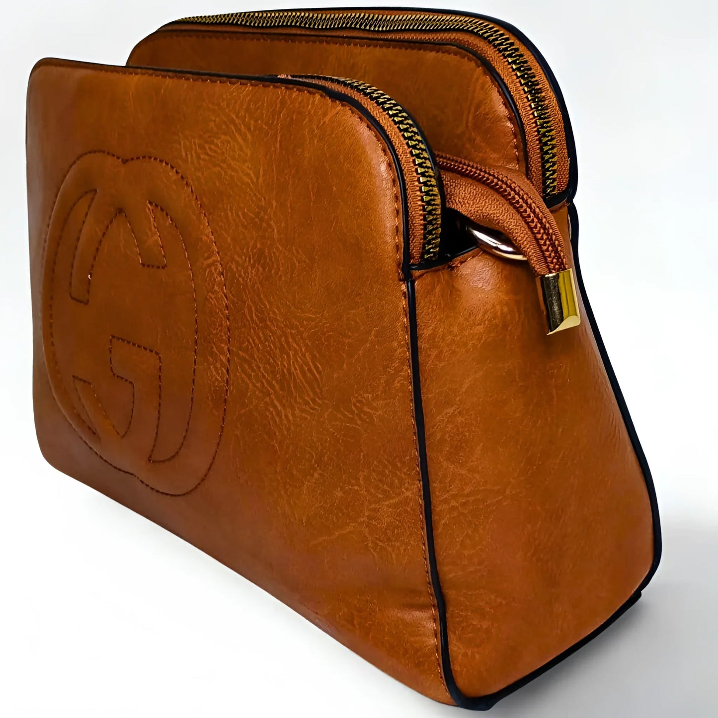 Brown leather bag with a gold zipper on a white background