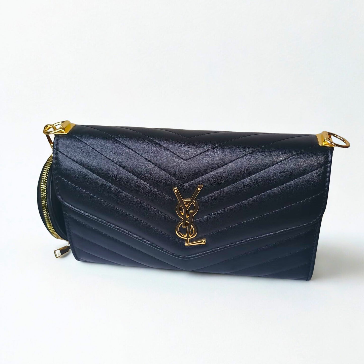 Navy blue handbag with gold accents on a white background