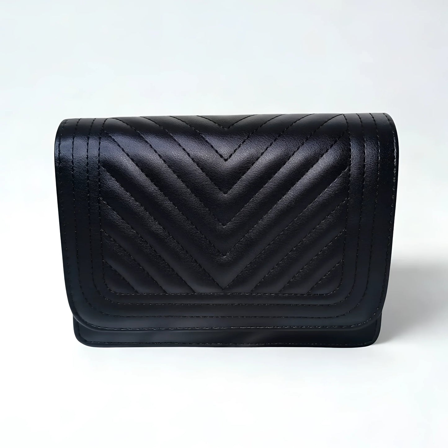 Black quilted handbag on a white background