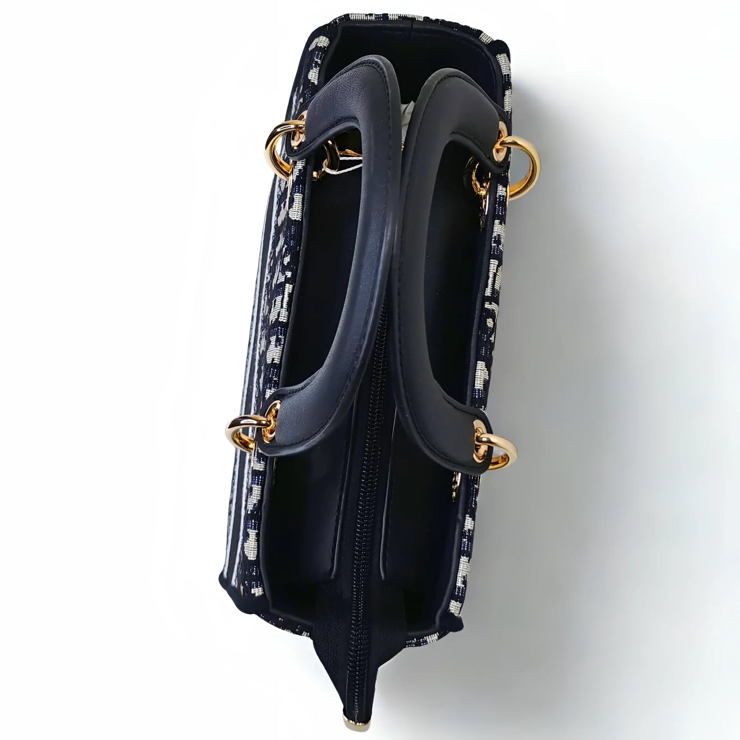 Navy handbag with gold accents on a white background