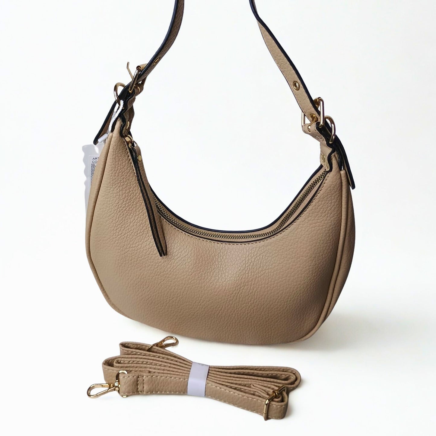 Beige handbag with matching strap on a white background