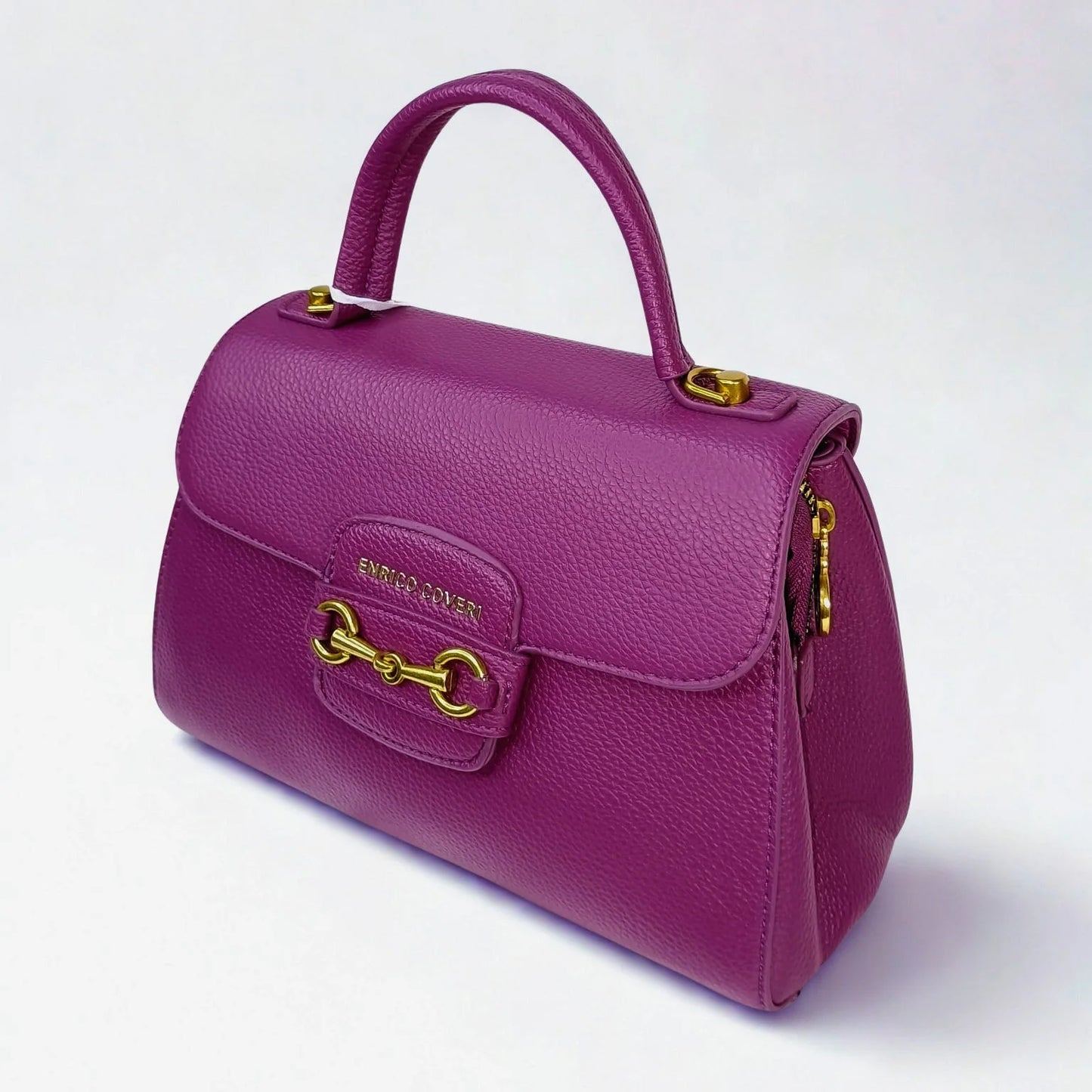 Purple handbag with gold accents on a white background