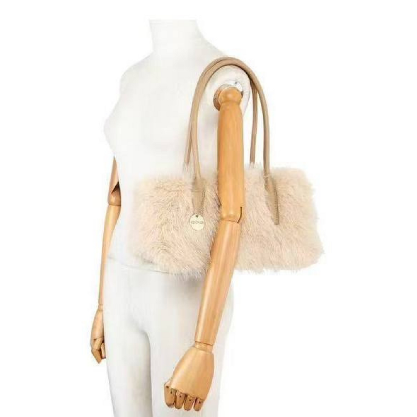 Mannequin wearing a beige fur vest with a matching handbag on a white background