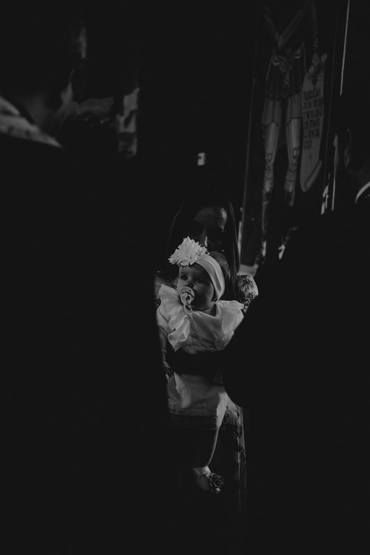 a black and white photo of a woman sitting in a chair