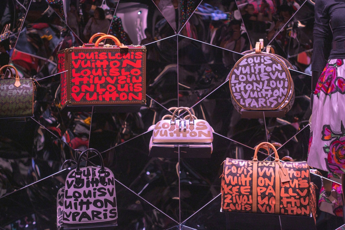 Luxury handbags displayed with repeating brand logos.