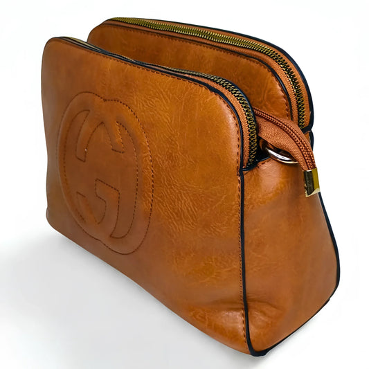 Brown leather bag with a prominent logo on a white background