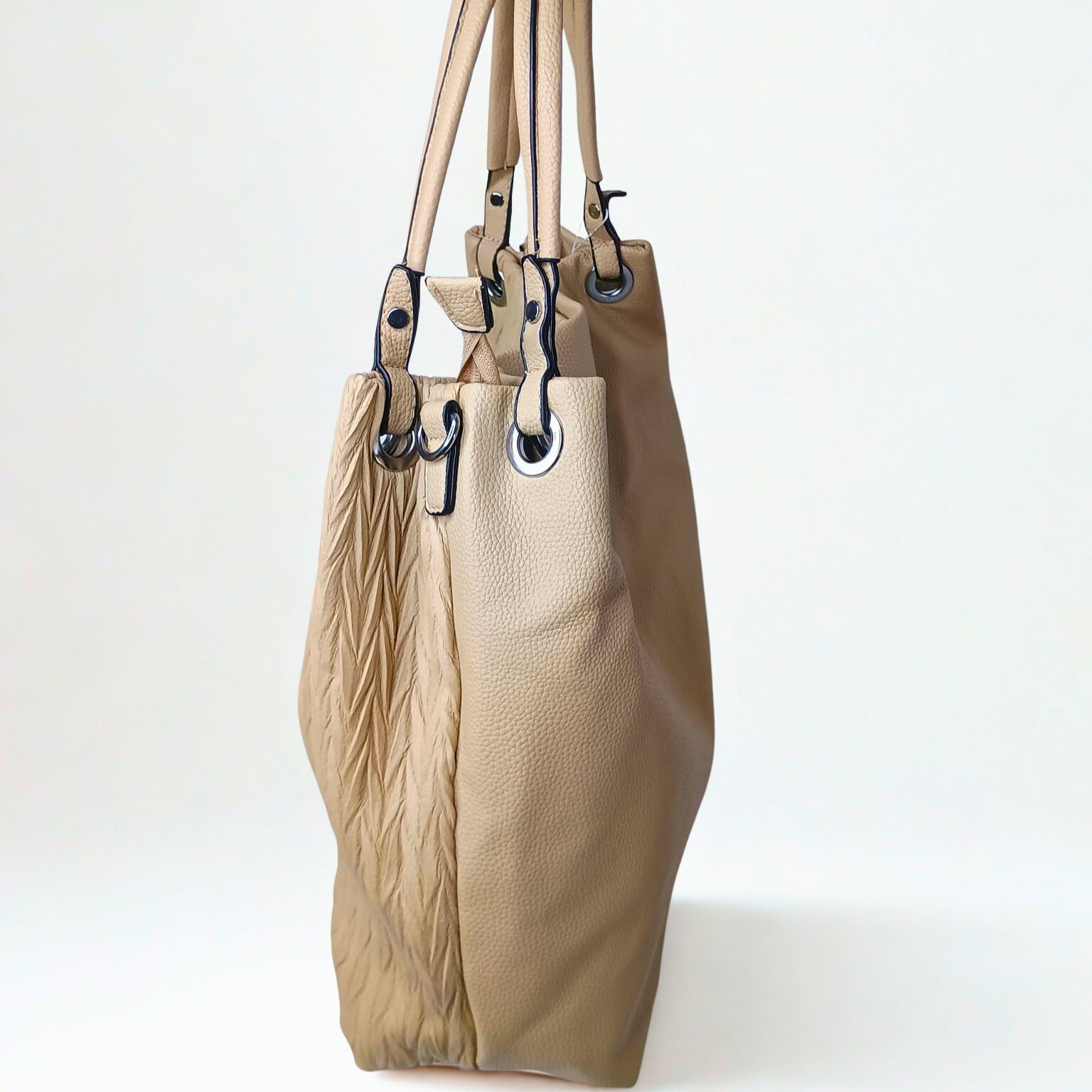 Beige handbag with leather texture on a white background