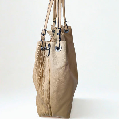 Beige handbag with leather texture on a white background