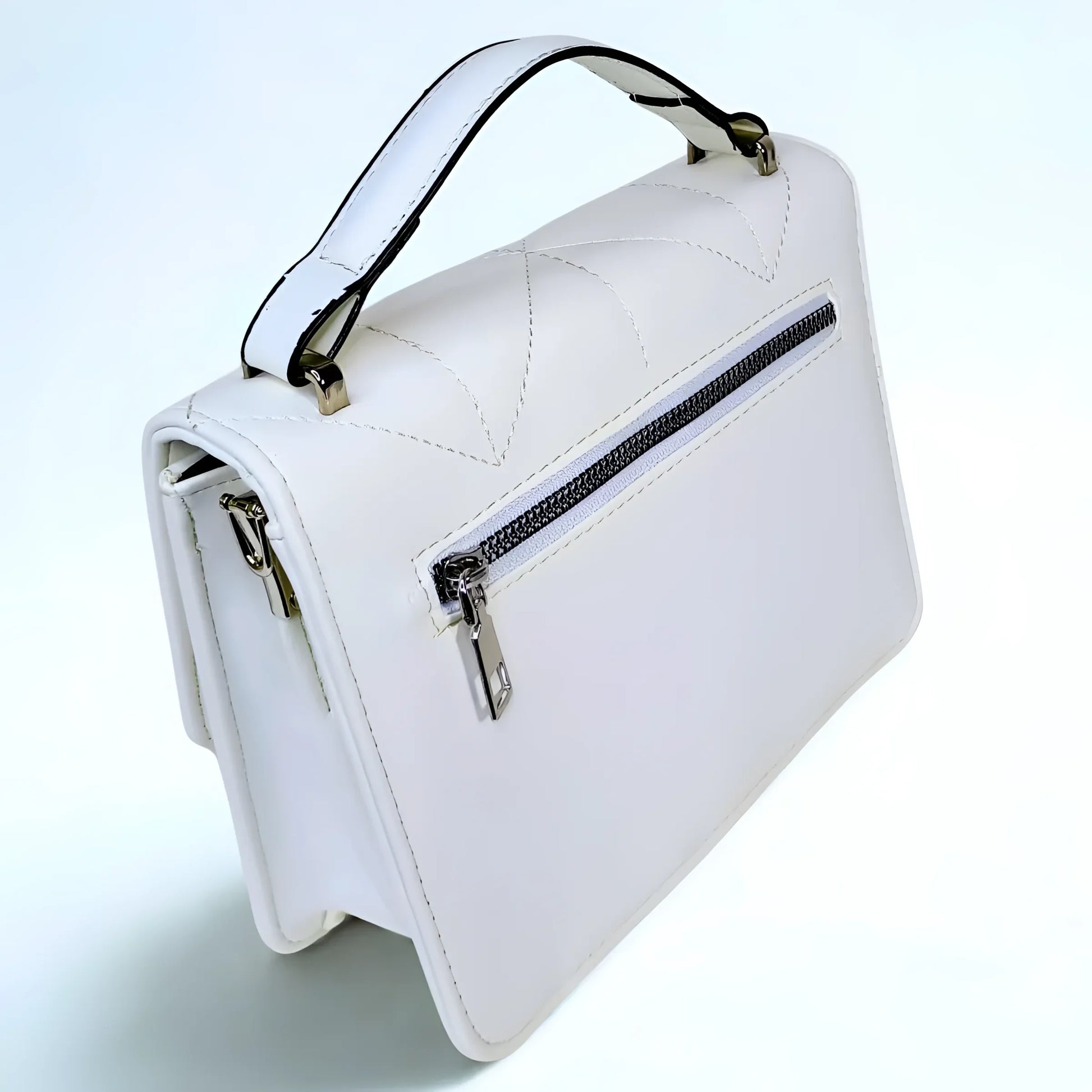 White handbag with a zipper on a light blue background