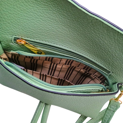 Green handbag with open zipper showing brown interior