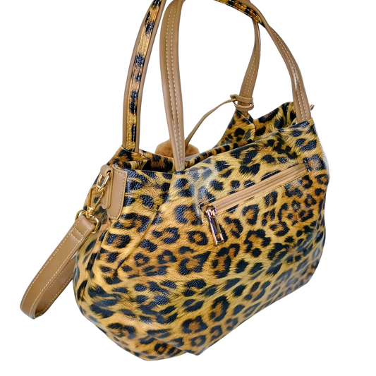 Leopard print handbag with beige accents on a white background