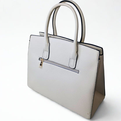 White handbag with beige accents on a white background