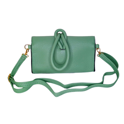 Green handbag with a strap on a white background