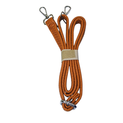 Orange leather bag strap with metal clasps for Brown Leather Hobo Bag, combining timeless style