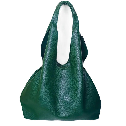 Green leather handbag on a white background