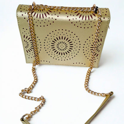 Gold handbag with chain strap on a white background