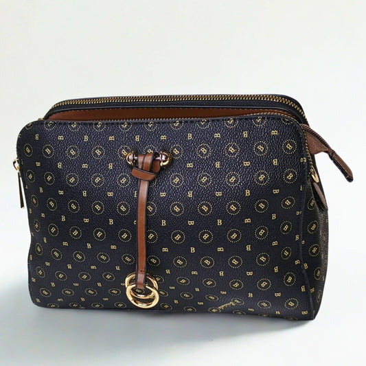 Navy blue handbag with gold pattern and brown leather accents on a white background