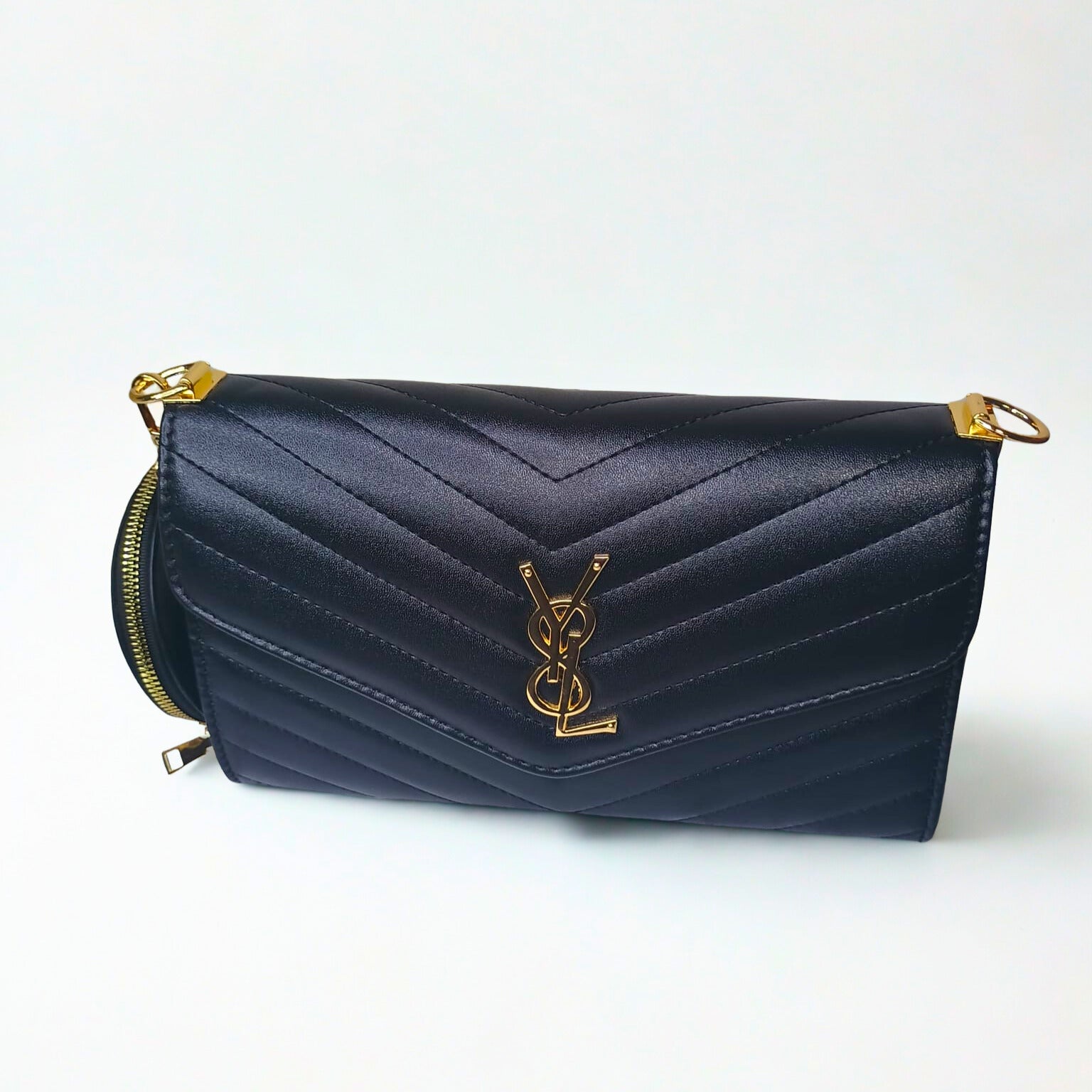 Navy blue handbag with gold accents on a white background