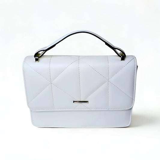 White quilted handbag on a light gray background