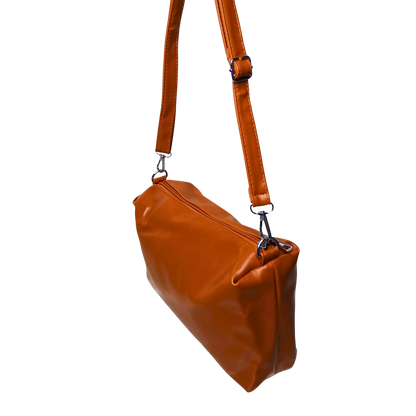 Brown leather handbag with a strap on a white background