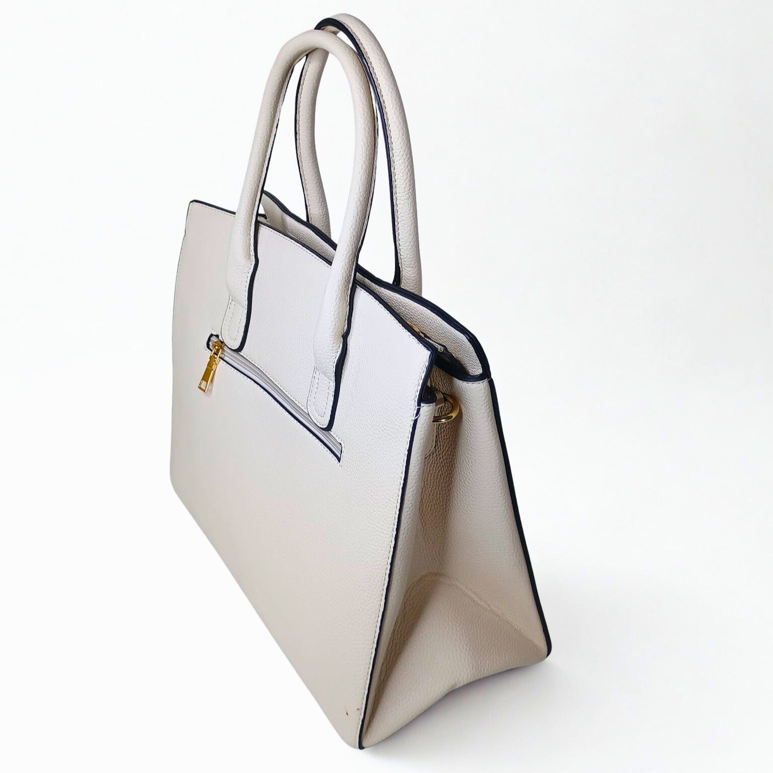 Beige handbag with a gold zipper on a white background