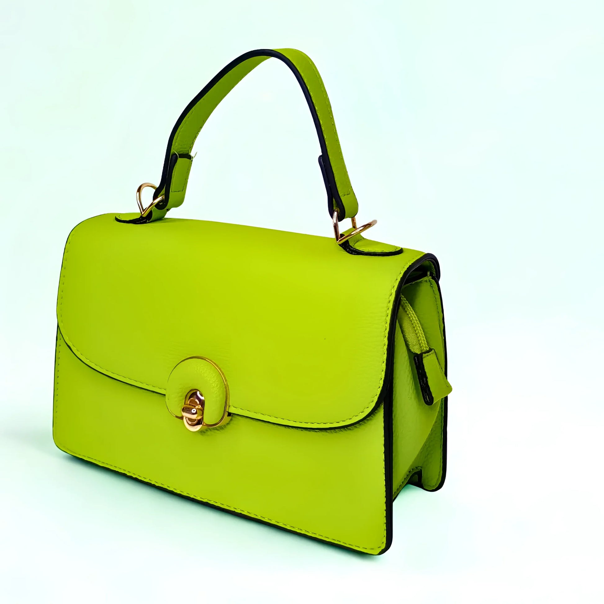 Green handbag with gold accents on a light blue background