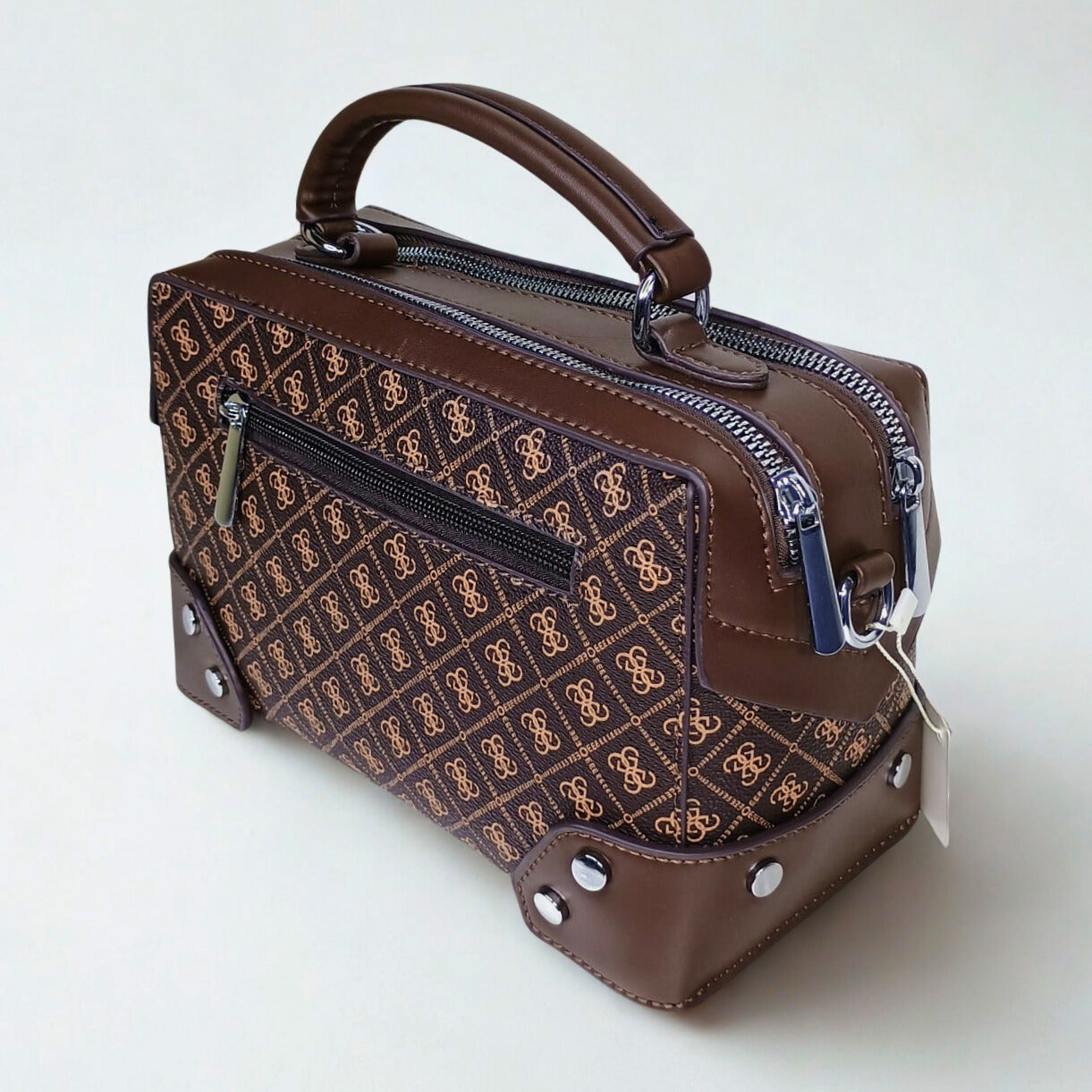 Brown handbag with a pattern on a white background