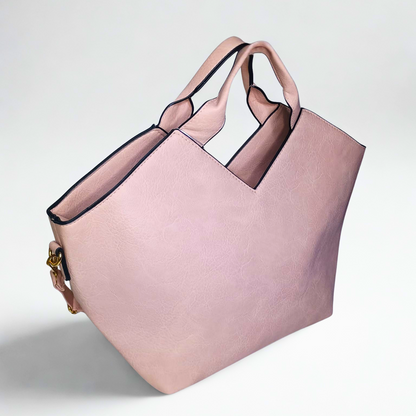 Pink tote bag with black accents on a light gray background