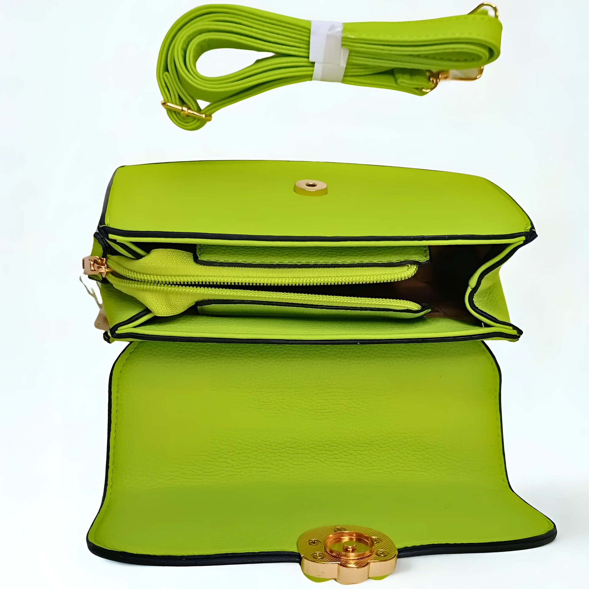 Green handbag with a strap and clasp on a white background